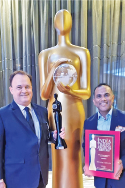 Chief Operating Officer (COO) Philip Logan and Senior Vice President Perkin Rocha of Royal Orchid Hotels with the award at Hyatt Regency in New Delhi.